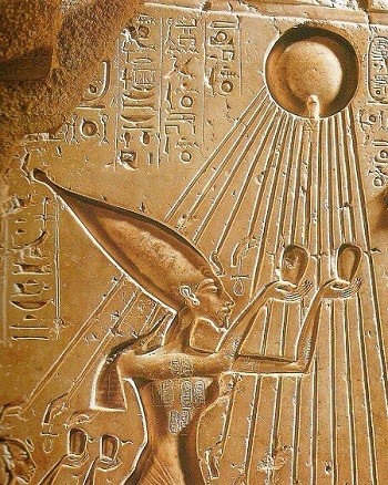 An Egyptian relief showcasing the goddess of the sun, radiating light and adorned with traditional symbols of divinity.