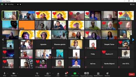 A screenshot displaying a group of individuals engaged in a video call, showcasing their faces and expressions.