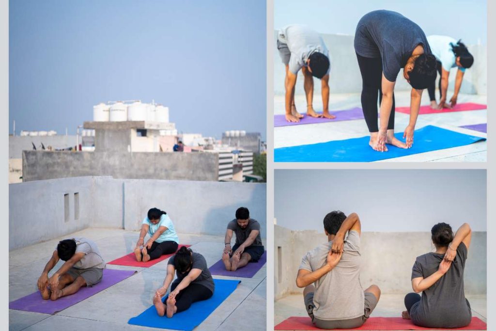 Four individuals practicing yoga on a rooftop, showcasing various poses against a city skyline backdrop.