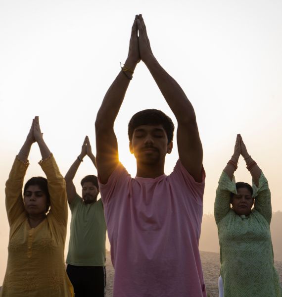 A serene individual practicing yoga in a tranquil setting, embodying the philosophy that yoga is a way of life.